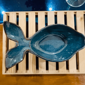 A fish shaped bowl on a table