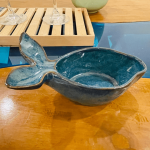 A fish shaped bowl on a table